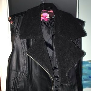 Black leather vest with faux shearling trim